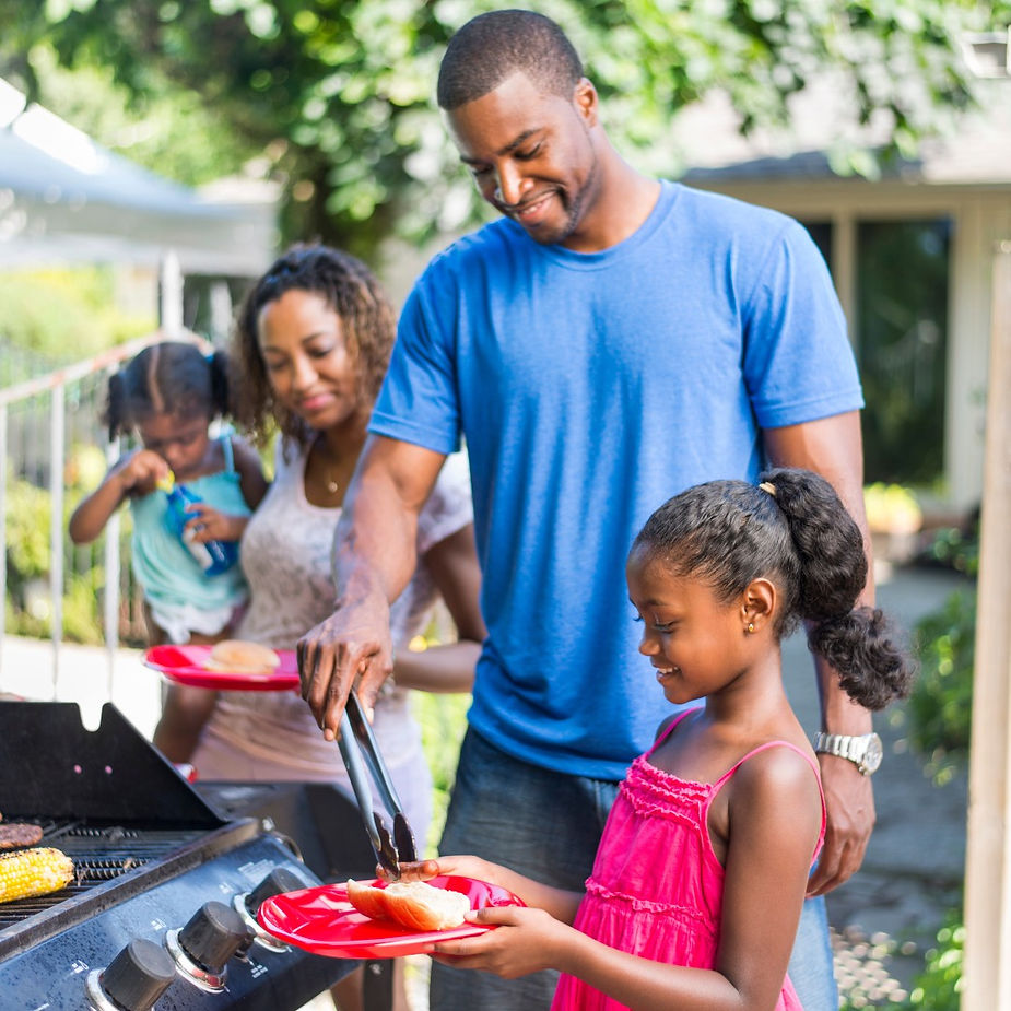 A family of four serving food in a plates, ready to eat