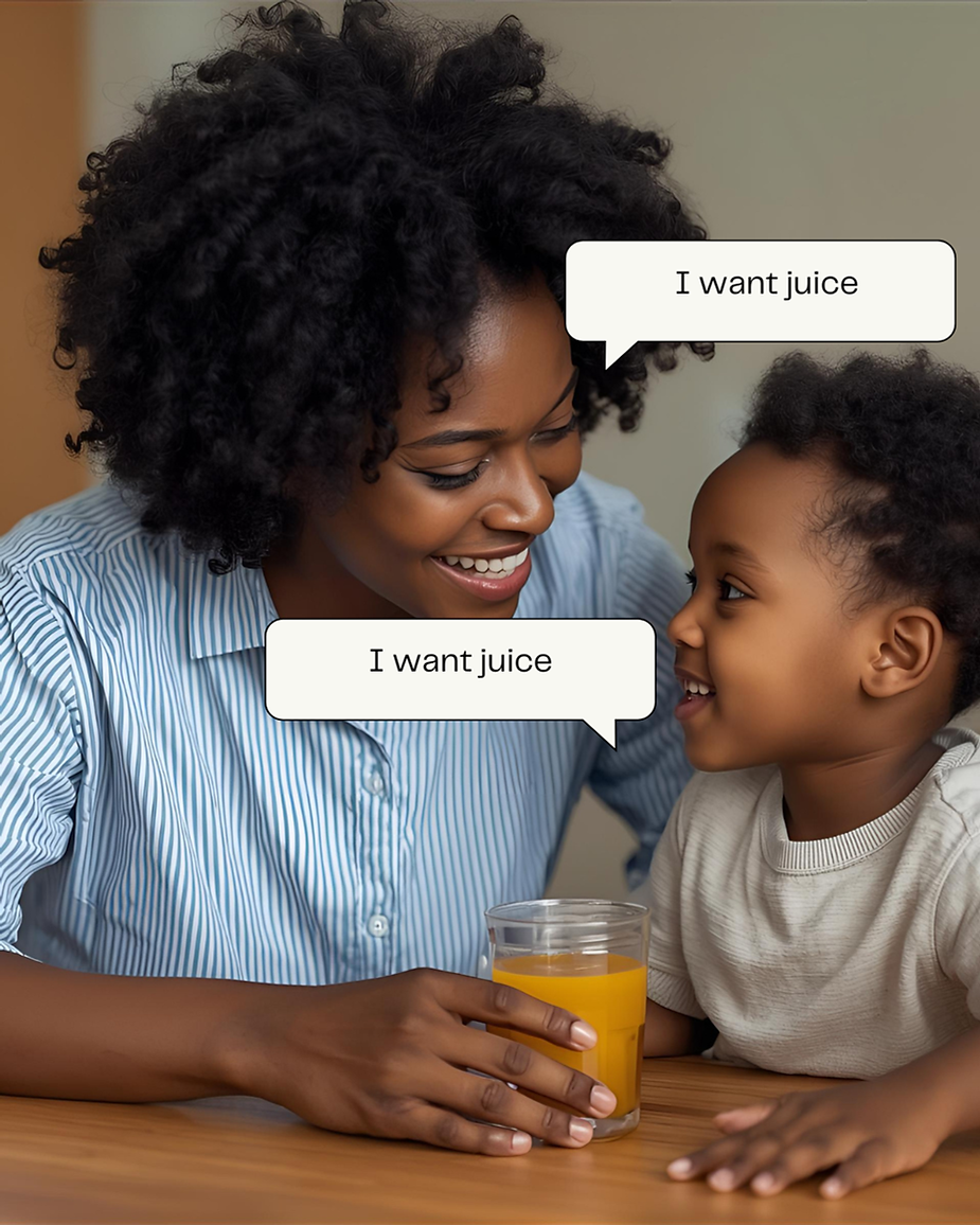 A woman and child seated at a table both say "I want juice" to help with echolalia.
